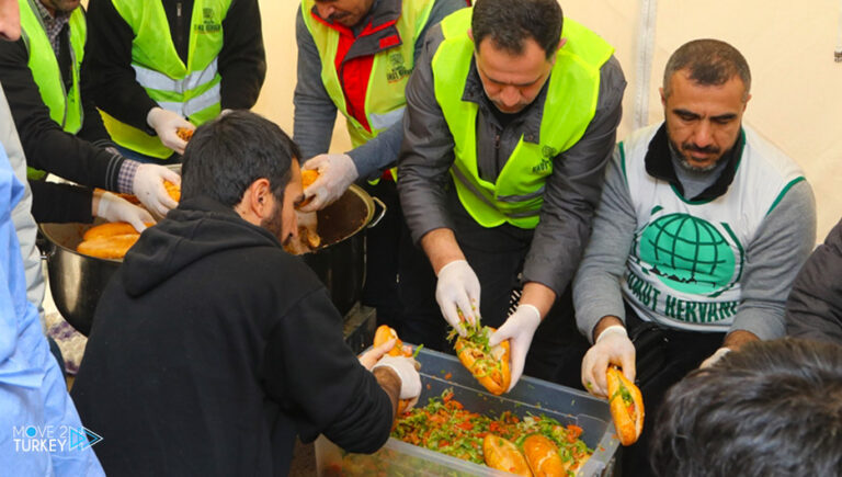 Distributing hot “European meals” to the earthquake victims